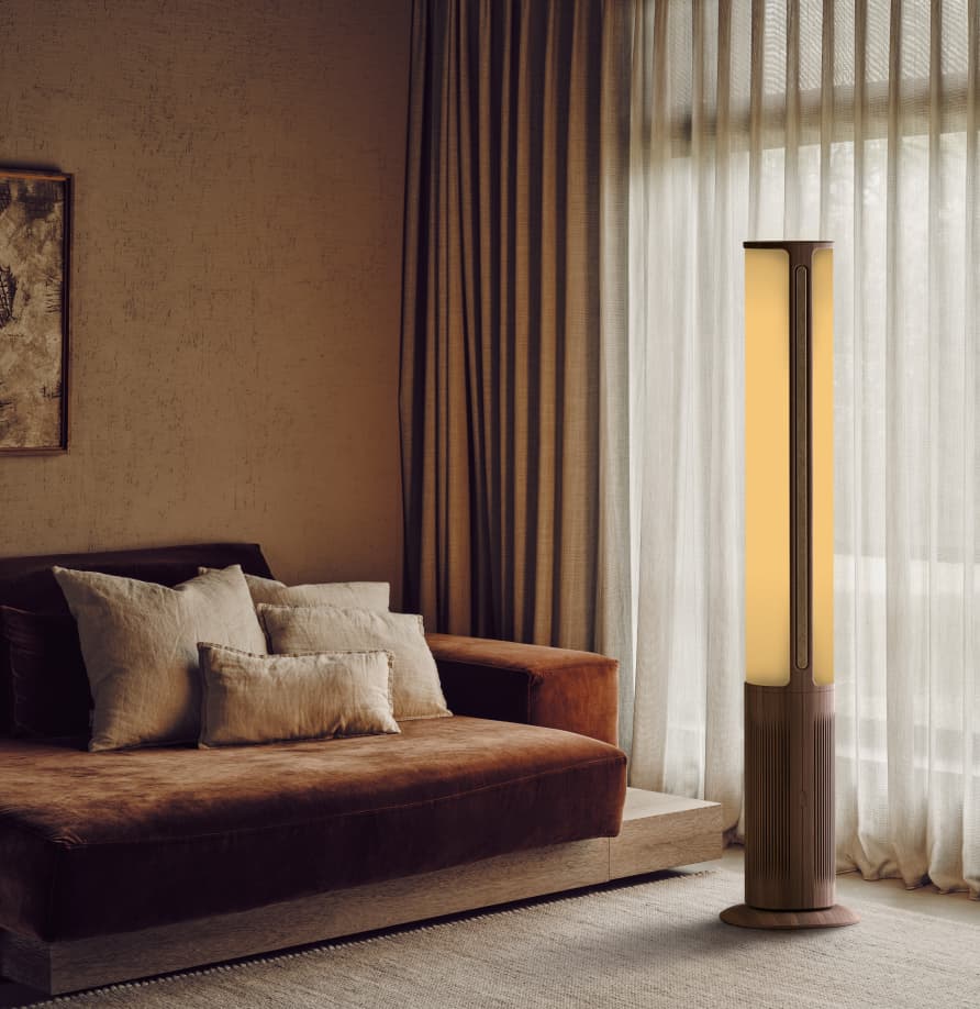 Ryuga floor lamp glowing warm in a living room